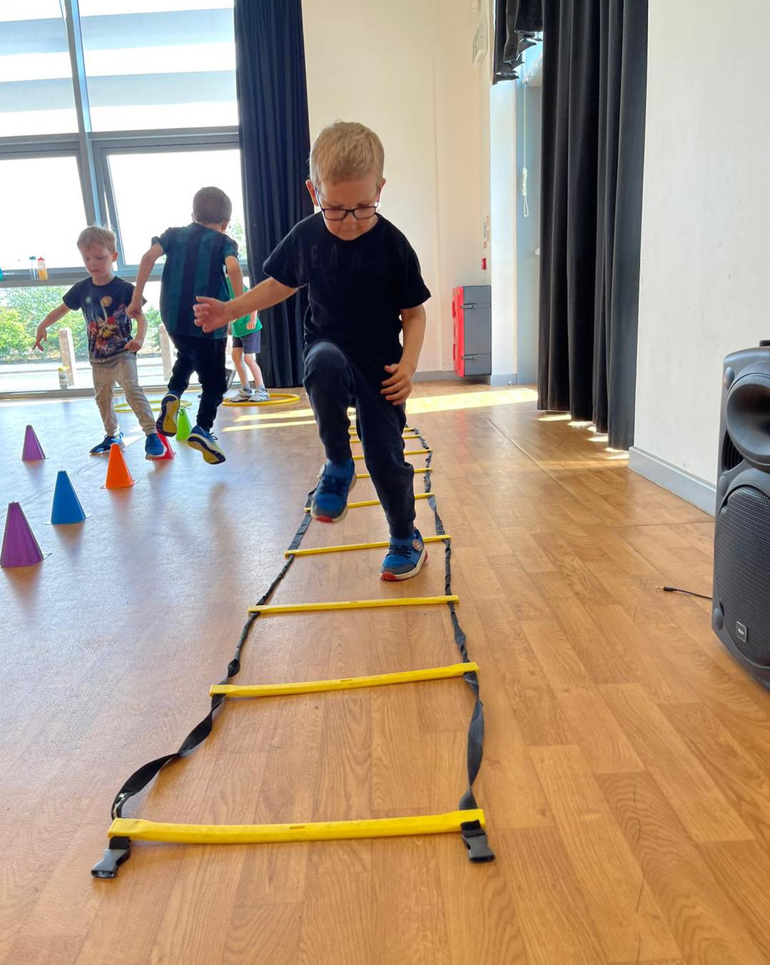 Children developing movement skills with PE Monkeys